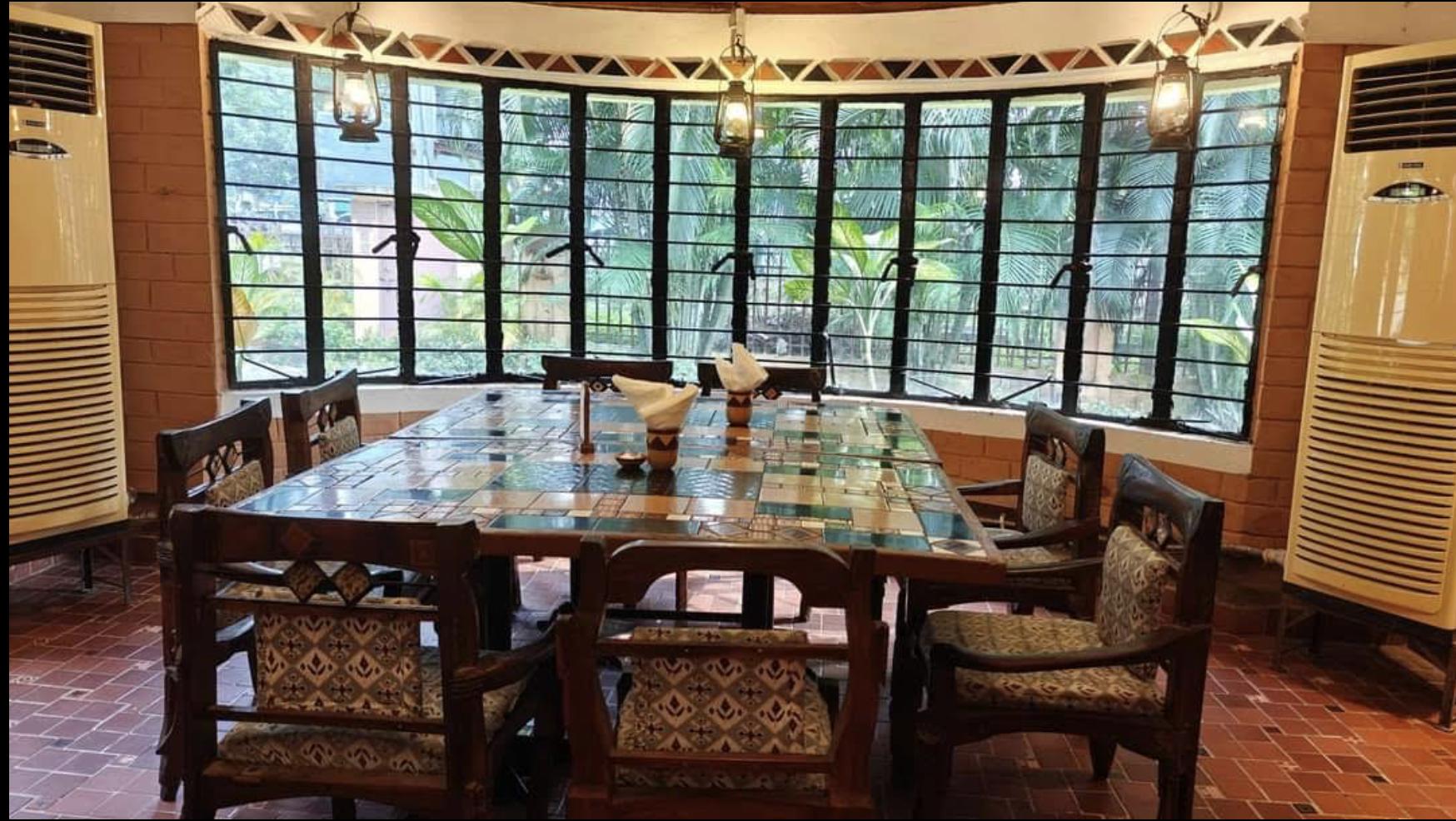 Ghare Baire café-style ambience with indoor and outdoor seating